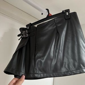 Black mini skirt with buckles
